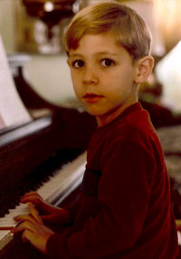 4 years old at the piano in 1981